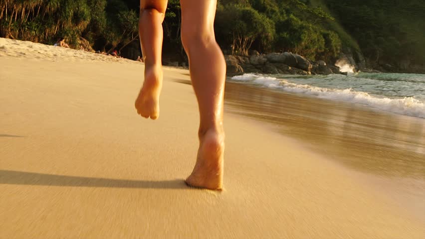 running on the beach barefoot