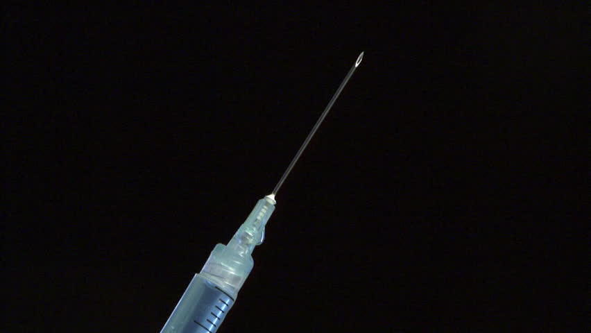 A Needle And Syringe Against Black Background Stock Footage Video ...