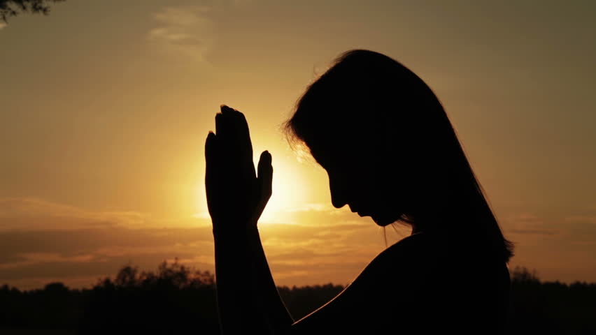 Silhouette Of Young Woman Praying In The Forest At Sunset. Sunset Light ...