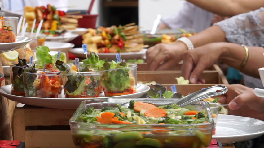 Waiters Serve A Food At A Birthday Celebration - Catering Services