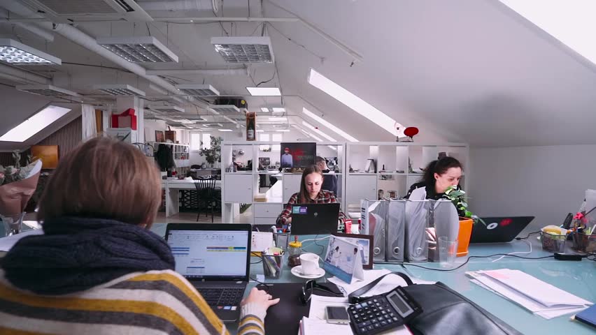 wide angle view busy design office. belarus minsk april 10 2017 modern office space people work on wide angle view busy design