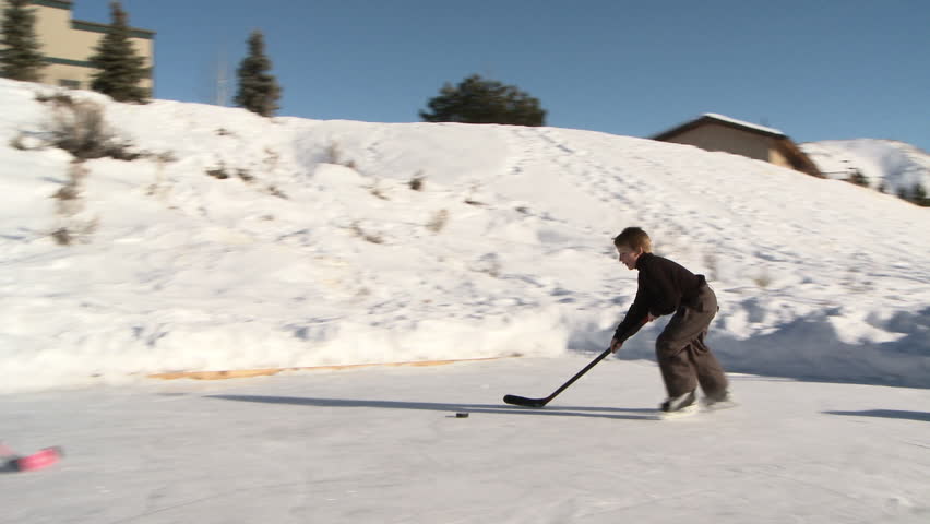 Hd00 21four Young Kids Play Hockey On Backyard Ice Rink