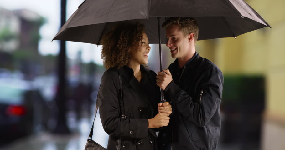 Image result for africans sharing an umbrella during rains