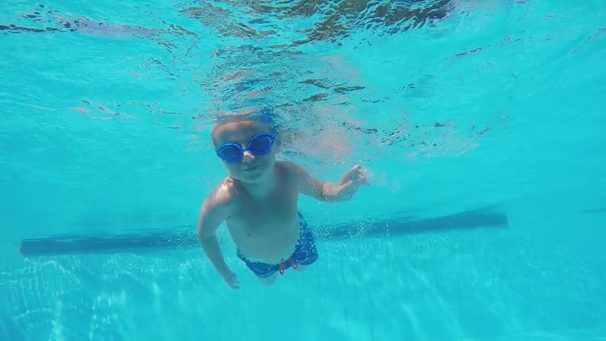Pool Water With Beach Ball children playing beach ball in swimming pool. stock footage video Pool Water With Beach Ball children playing beach ball in swimming pool. stock footage video