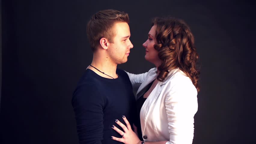 Man And Woman Looking At Each Other With Passion And Smiling Man And Woman Looking At Each Other With Passion And Smiling