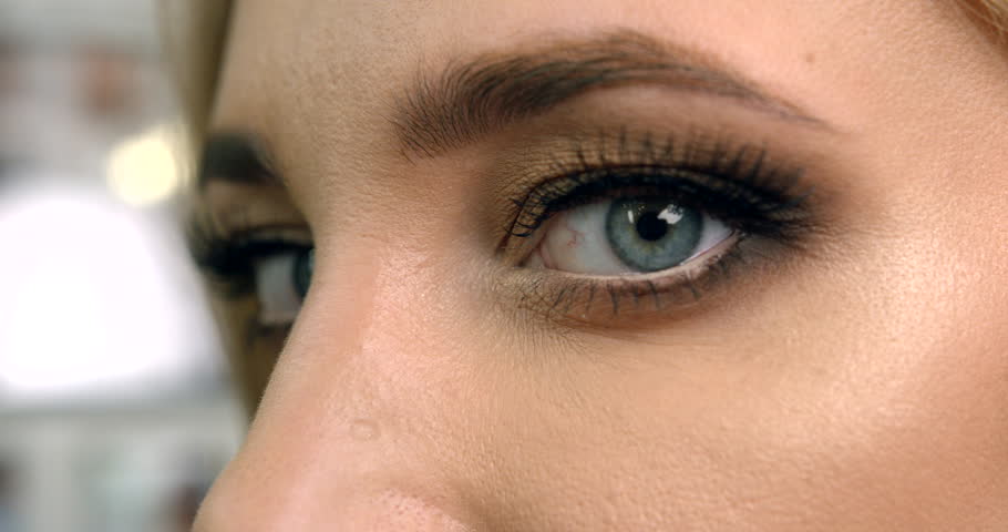 Close Up Side View Of The Grey Female Eyes Covered With Black And