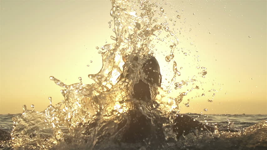 Slow motion 240 FPS girl fixing her hair in sea sunset 