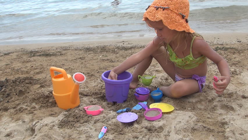 Child Little Playing With Stock Footage Video 100 Royalty Child Little Playing With Toys In Sand By Beach Waves Coastline Sea Children On Seas