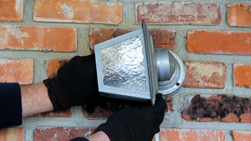 Blue Tint Light Bulb Removed Stock Footage 100 Royalty Free Blue Tint Light Bulb Removed From Old Loose Outdoor House Fixture By Male Wearing Black Gloves