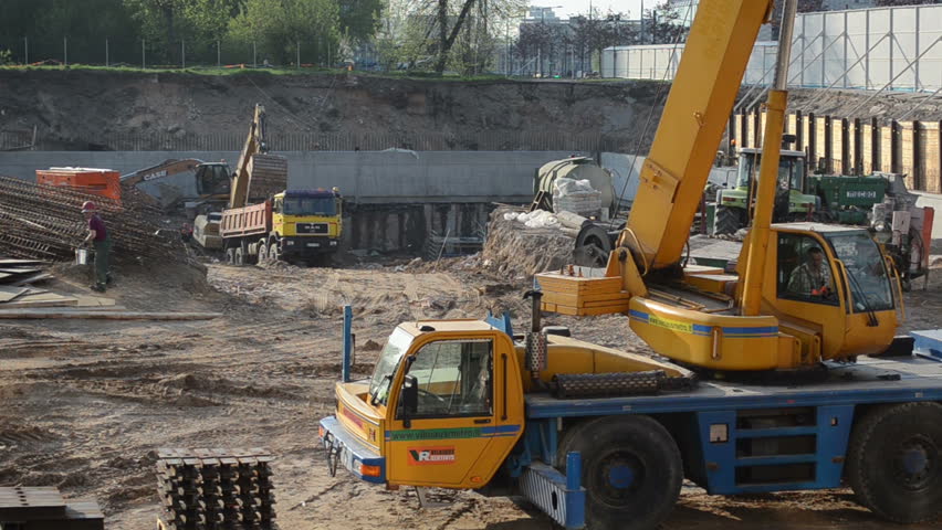 People Work With Crane Excavator And Trucks Circa May In Vilnius ...