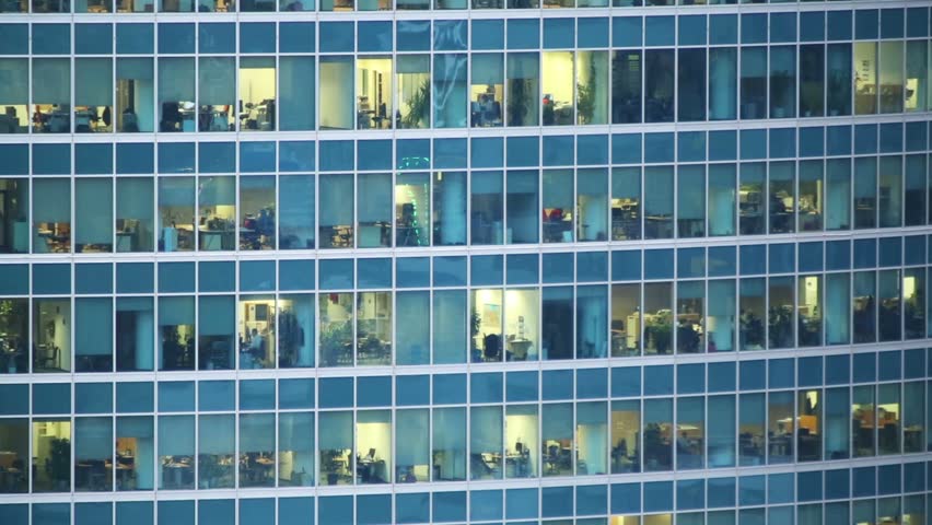 building an office. many people in a windows of modern skyscraper office building - hd stock video clip an