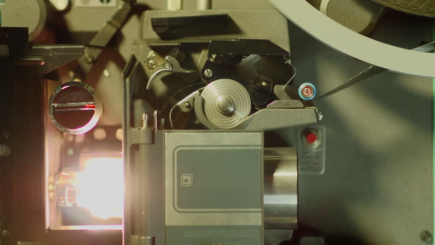 Close Up Of 16mm Film Running Through A Projector In Slow Motion. Stock ...