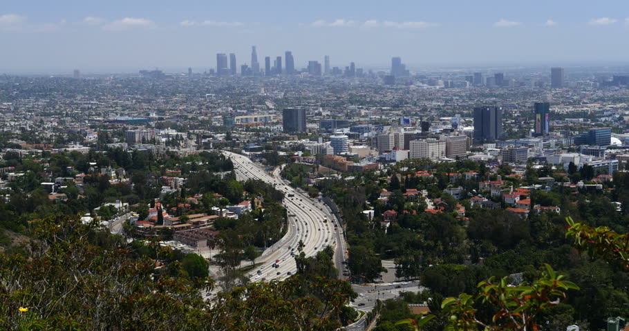 Sunset Over Hollywood And Downtown Los Angeles With Traffic On The 101