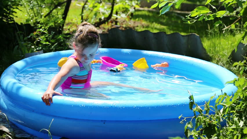 Lovely Girl Relaxing In A Pool Set In The Backyard Stock Footage Video ...