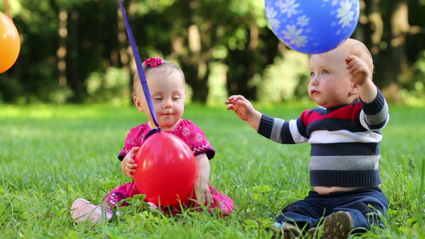 Image of funny baby playing in the park