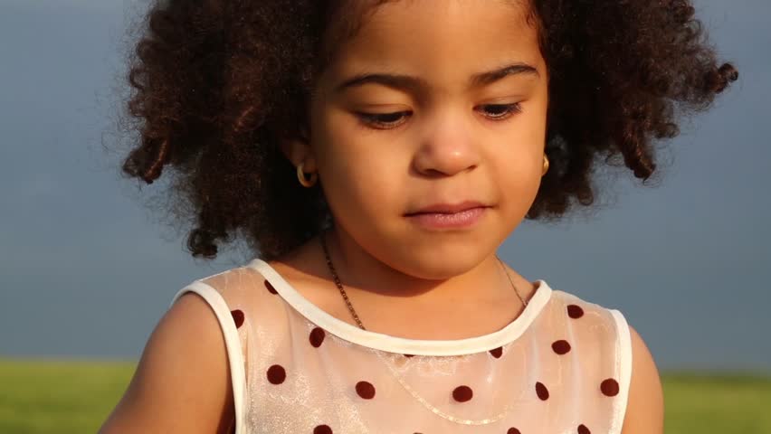 Close Up Portrait Of Little Mixed Race Girl With Curly Hair