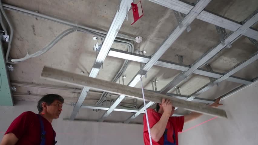 Hd00 05workers Verify Accuracy Of Installation Frame For Hung Ceiling