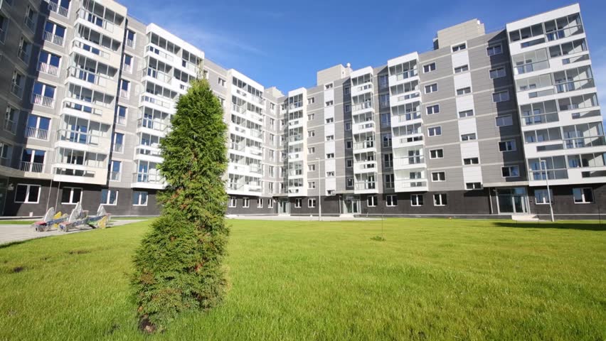 Sixstory Stock Video Footage 4k And Hd Clips Shutterstock Sixstory Apartment Building In Residential Complex And Tree