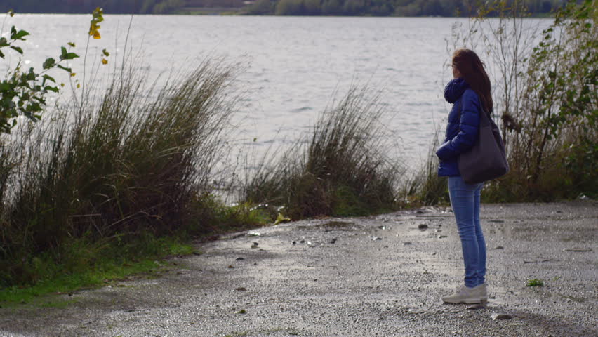 Stockvideo Von Young Woman Standing Alone And Sad 