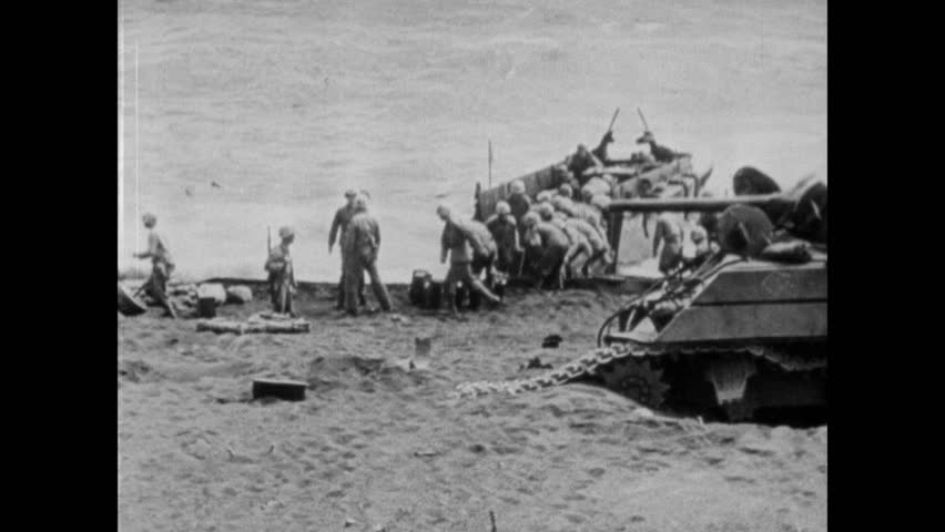 U.S. Marines Unload Supplies And Weapons Form The Landing Boats On ...