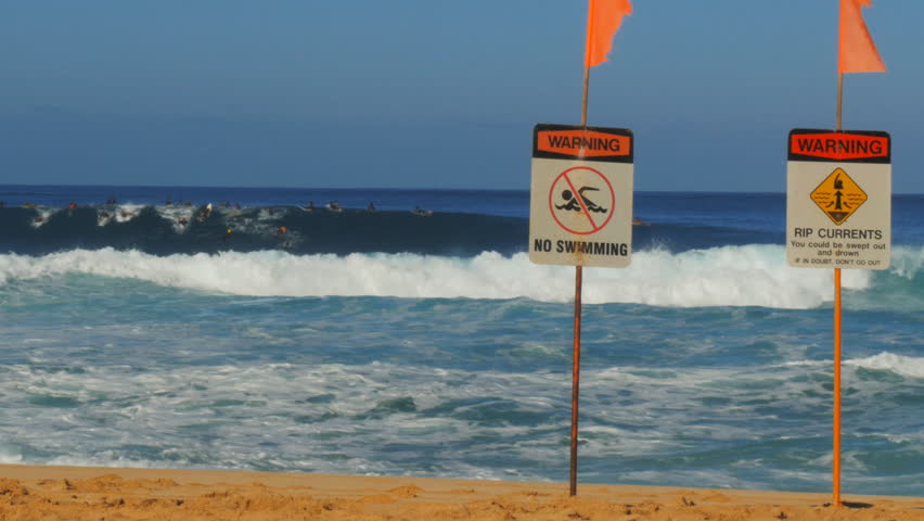 Warning Strong Current And No Swimming Sign In Front Of The Waves At ...