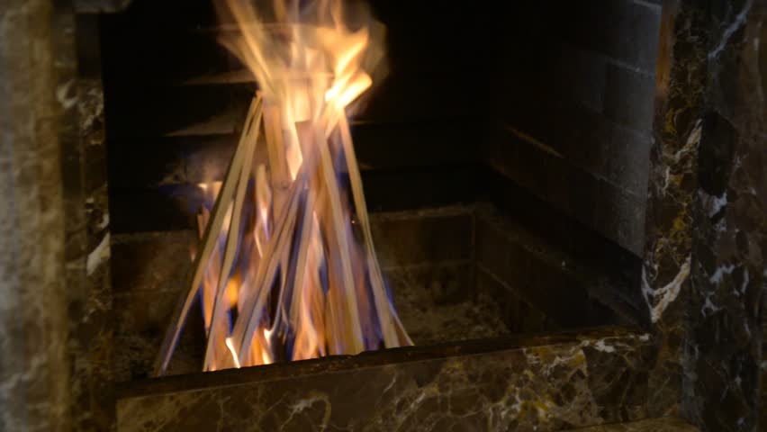 Hd00 06burning Wood In A Fireplace A Man Pours Lighter Fluid